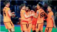  ?? — AP ?? Liverpool’s Mohamed Salah (3rd left) celebrates after scoring his side’s second goal against Porto.