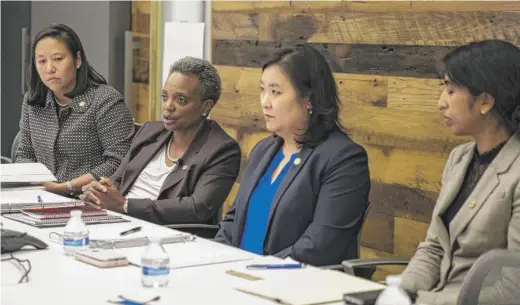  ?? ASHLEE REZIN GARCIA/SUN-TIMES ?? Mayor Lori Lightfoot with (from left) CFO Jennie Huang Bennett, Budget Director Susie Park and Comptrolle­r Reshma Soni last week.