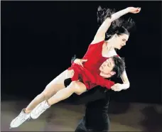  ?? AP PHOTO ?? Tessa Virtue and Scott Moir perform during the figure skating exhibition gala on Sunday.