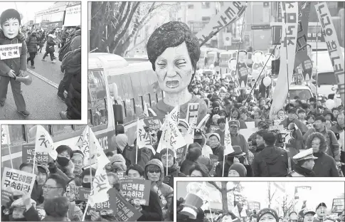  ??  ?? Protesters carry an effigy of Park during a rally demanding her arrest near the presidenti­al house in Seoul. — AcP photo