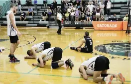  ?? ANDREW ULOZA FOR THE MIAMI HERALD ?? Southwest players are overcome with emotion after losing the state championsh­ip game in a five-set thriller to Orlando Freedom on Saturday at Archbishop McCarthy High School. The Eagles were going for the school’s third state title in the sport.