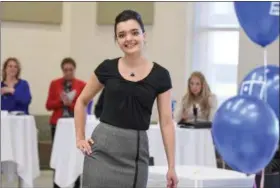  ?? ERIC BONZAR — THE MORNING JOURNAL ?? Lorain County Community College business major Madison Widener competes in the business profession­al portion of Goodwill of Lorain County and LCCC Career Services’ “Make It Work!” style show March 29.