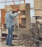  ?? ?? Workers at the Columbus Washboard Co. use modern tools as well as antique equipment to hand-assemble the washboards.