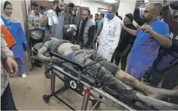  ?? ADEL HANA/AP ?? Palestinia­ns wounded in the Israeli bombardmen­t of the Gaza Strip are brought to the hospital in Deir al Balah on Tuesday.