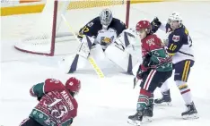  ?? BERND FRANKE/REGIONAL SPORTS EDITOR ?? Niagara’s Kirill Maksimov, No. 13, fires the puck at Barrie goaltender Leo Lazarev in Ontario Hockey League action.