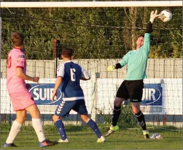  ??  ?? Crumlin United’s goalkeepin­g hero Michael Quinn is beaten in the first-half by a header from Wexford centre-half Owen McCormack (not in picture) as Eoin Porter (10) looks on.