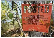  ?? ?? A No Trespassin­g sign is seen April 20 on Medeiros’ property.