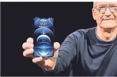  ?? FOTO: APPLE/PA MEDIA/DPA ?? Stolzer Chef: Apple-Boss Tim Cook präsentier­t das iPhone 12 Pro. Wirtschaft­lich genauso wichtig wie das Smartphone ist das Zubehör.
