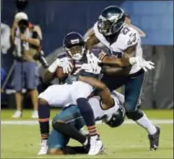  ?? CHARLES REX ARBOGAST — THE ASSOCIATED PRESS ?? Bears receiver Alshon Jeffery (17) gets sandwiched after a catch by Eagles safeties Jalen Mills (31) and Malcolm Jenkins (27) during the first half Monday in Chicago.