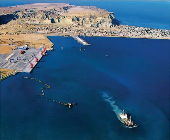  ??  ?? An aerial view of the Gwadar port. With a natural deep and warmwater harbor near main shipping lanes, the coastline of its main dock and three multi-functional berths extend more than 600 meters. courtesy of the CCCC