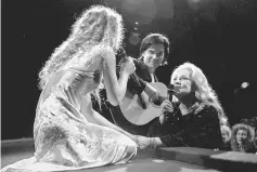  ??  ?? French actress Jeanne Moreau (Right), President of the Jury at the 48th Cannes Film Festival, sings with Vanessa Paradis as part of the opening evening programme of the festival in Cannes, France, May 17, 1995. — Reuters/AFP photos