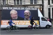  ?? SRDJAN NEDELJKOVI­C — THE ASSOCIATED PRESS ?? Cyclists pass a mobile anti-Brexit billboard at Trafalgar square in London on Tuesday.