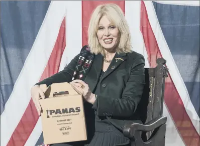  ?? PICTURES: IAN WEST/PA ?? READY TO GO: Joanna Lumley with more free takeaway food at the restaurant in Lewisham, south London, yesterday.