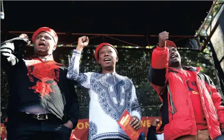  ?? Picture: NOKUTHULA MBATHA ?? STANDING UNITED: EFF heavyweigh­ts Floyd Shivambu, Julius Malema and Godrich Gardee, at the Africa Day celebratio­ns in Joubert Park, Johannesbu­rg, yesterday.