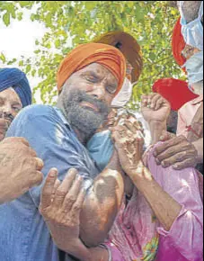  ?? PTI ?? A relative of a victim of the hooch tragedy gets emotional outside the Tarn Taran civil hospital on Sunday.