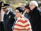  ?? KYLE TELECHAN/POST-TRIBUNE ?? Presidenti­al candidate and U.S. Sen. Bernie Sanders, right, arrives at a community meeting Saturday at the Genesis Convention Center.