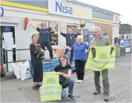  ??  ?? Sterling work Nisa staff and Murthly community volunteers, front from left, Angela Fearns, Caroline Buchanan, staff member Lily Davies and Ted Carr. Back, Margaret Wilson (staff ) and Alistair Johnston, owner of Nisa Local Murthy