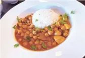  ??  ?? Chana masala with chickpeas, tomatoes, onions, spices and basmati rice at Sherpa Kitchen in Gilbert.