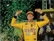  ?? ASSOCIATED PRESS ?? KYLE BUSCH CELEBRATES in Victory Lane after winning a NASCAR Cup Series auto racing season championsh­ip on Sunday at Homestead-Miami Speedway in Homestead, Fla.