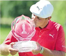  ?? DAVID DERMER/AP ?? American Bryson DeChambeau kisses the champion’s trophy after winning the Memorial golf title in a playoff Sunday in Dublin, Ohio, for his second PGA Tour victory in two years.