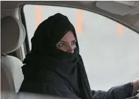  ?? AP file ?? A woman drives a car on a highway in Riyadh. —