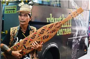  ??  ?? Mathew Ngau Jau, a sape master from Sarawak, will be on a Tuyang Initiative tour – holding a workshop and performanc­e.