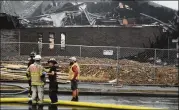  ?? AP FILE ?? Emergency responders coordinate as firefighte­rs put out a fire Dec. 31 at Planned Parenthood in Knoxville, Tennessee. The fire comes as the U.S. Supreme Court considers a case that could reduce abortion rights.