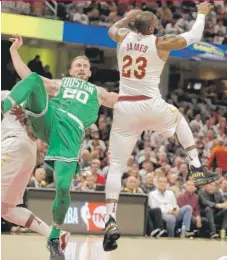  ?? | AP ?? The Celtics’ Gordon Hayward suffered a broken left ankle when he landed awkwardly on a failed alley- oop Tuesday against the Cavaliers.