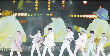  ?? Bighit Music ?? THE MEMBERS of BTS show off their moves live — and on-screen — during their show in Inglewood.