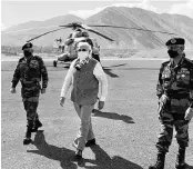  ?? PHOTO:PTI ?? PM Narendra Modi ( centre) along with Chief of Defence Staff Gen Bipin Rawat ( left) arrives in Leh, on Friday