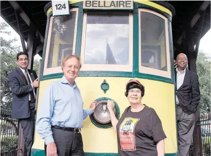  ?? Chronicle file photo ?? Bellaire Historical Society board members Randy McKinney, left, Patrick Durio, secretary Lynn McBee and Winfred Frazier are shown with the trolley in the Bellaire esplanade on South Rice in a shot taken several years ago. The society’s goal is to...