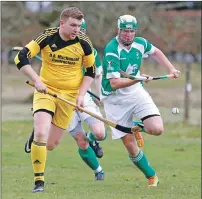  ??  ?? Inveraray’s Lewis MacNicol and Beauly’s Calum Morrison in a chase for the ball during last Saturday’s National Division game at the Winterton.