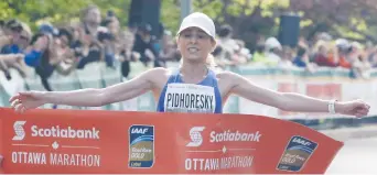  ?? PATRICK DOYLE ?? Windsor’s Dayna Pidhoresky, who won the Canadian women’s marathon in Ottawa last May, has already qualified for the 2020 Tokyo Games. “It would be incredibly disappoint­ing if they are cancelled,” she says.