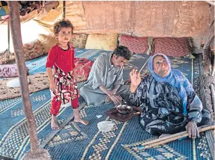  ?? Picture: Getty. ?? A displaced Syrian family sit in their tent in the Atmeh camp near the Syrian-Turkish border in Idlib Province.