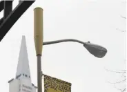  ?? Lea Suzuki / The Chronicle ?? An enclosure for a small-cell antenna sits on top of a light pole in San Francisco. Gov. Jerry Brown vetoed a bill that would have given the state control over where antennas are placed.