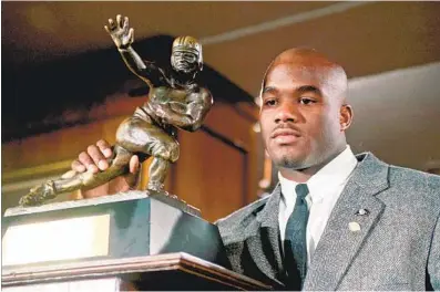  ?? ADAM NADEL / AP ?? Local running back Rashaan Salaam poses with his Heisman Trophy at the Downtown Athletic Club in New York in 1994.