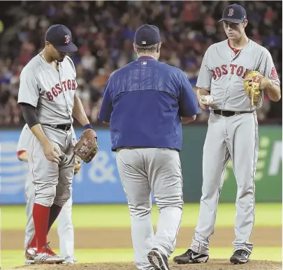  ?? AP PHOTO ?? YOU’RE OUT: Shortstop Xander Bogaerts hangs his head as manager John Farrell gives starter Doug Fister the hook during the fourth inning of last night’s loss to the Rangers.