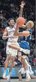  ?? / AP - Don Petersen ?? Virginia Tech’s Nickeil Alexander- Walker defends against Georgia Tech’s Brandon Alston during the first half of Wednesday night’s game.