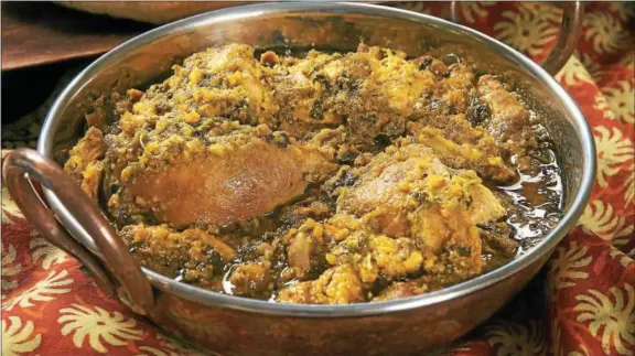  ?? PHOTO COURTESY OF BRAVE NEW PICTURES ?? Enjoy this traditiona­l chicken curry from “The Indian Slow Cooker” by Anupy Singla.