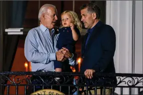  ?? (The Washington Post/Demetrius Freeman) ?? President Joe Biden spends time with son Hunter Biden and grandson Beau Biden during the Fourth of July celebratio­n at the White House earlier this year.