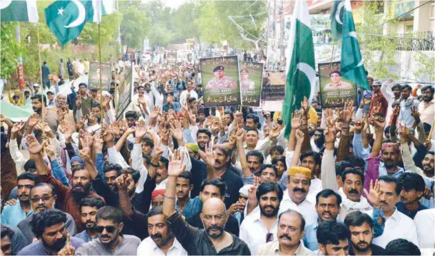  ?? Associated Press ?? ↑
People take part in a rally to show solidarity with the army in Hyderabad on Thursday.