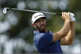  ?? ADAM HUNGER — THE ASSOCIATED PRESS ?? Dustin Johnson tees off on the second hole during final- round play at The Northern Trust golf tournament on Sunday in Old Westbury, N. Y.