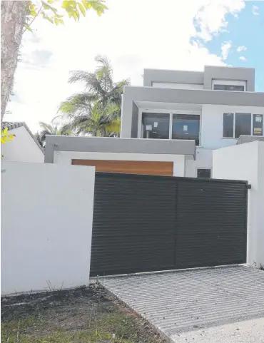  ??  ?? Council records show this Broadbeach Waters house has not been approved. Right: Adrian Hill.