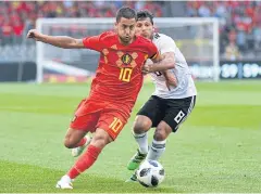  ?? AP ?? Belgium’s Eden Hazard, left, is pursued by Egypt’s Tarek Hamed.