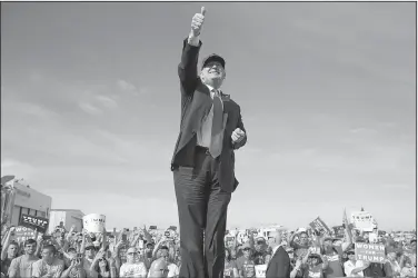  ?? AP/EVAN VUCCI ?? Donald Trump greets the crowd as he arrives for a rally Tuesday in Sanford, Fla.