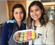  ?? PETE BANNAN - MEDIANEWS GROUP ?? Huong Bui Sugar and Spice Thai food & more opened on West Chester Pike in Havertown this January. She is seen here on the left holding homemade macarons with her daughter Kristine Tassananpa­rk.