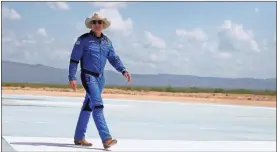  ?? Joe Raedle/Getty Images/TNS ?? In this photo from July 20, 2021, Jeff Bezos walks near Blue Origin’s New Shepard after flying into space in Van Horn, Texas.