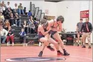  ?? Tim Godbee ?? The Sonoravill­e wrestling team, shown here in action against Calhoun, is presently having another great season as the team competes for a fourth 3A state championsh­ip.