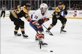  ?? JOHN MINCHILLO - THE ASSOCIATED PRESS ?? New York Islanders center Mathew Barzal (13) is slashed by Boston Bruins defenseman Zdeno Chara (33) on a breakaway drive to the net during the second period an NHL hockey game, Saturday, Feb. 29, 2020, in Uniondale, NY.