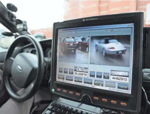  ?? JESSICA J. TREVINO/DETROIT FREE PRESS ?? A screen inside the cruiser of a Macomb County Sheriff’s deputy displays the the results of an automatic license plate reader scan in October 2013. Detroit police adopted the use of mobile and stationary license plate readers in 2018, and on Tuesday the Detroit City Council approved a $5 million expansion that will add 100 more cameras at 25 intersecti­ons.